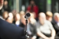 microphone in focus against blurred audience