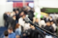 microphone in focus against blurred audience