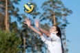 Woman playing volleyball on beach