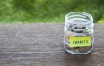 Charity donation money glass jar